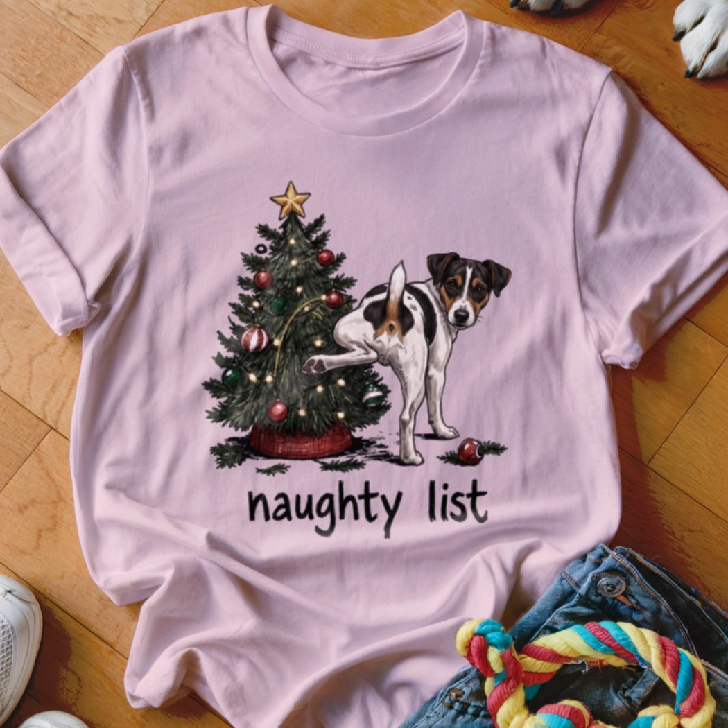 Pink t-shirt with a Jack Russell terrier by a Christmas tree, reading "naughty list".