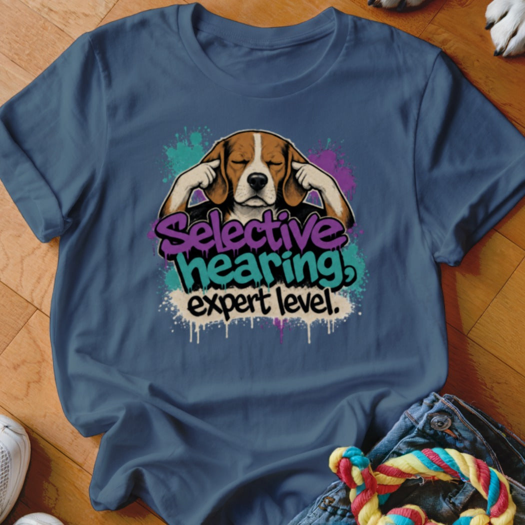 Beagle dog with ears covered and text "Selective hearing! expert level."
