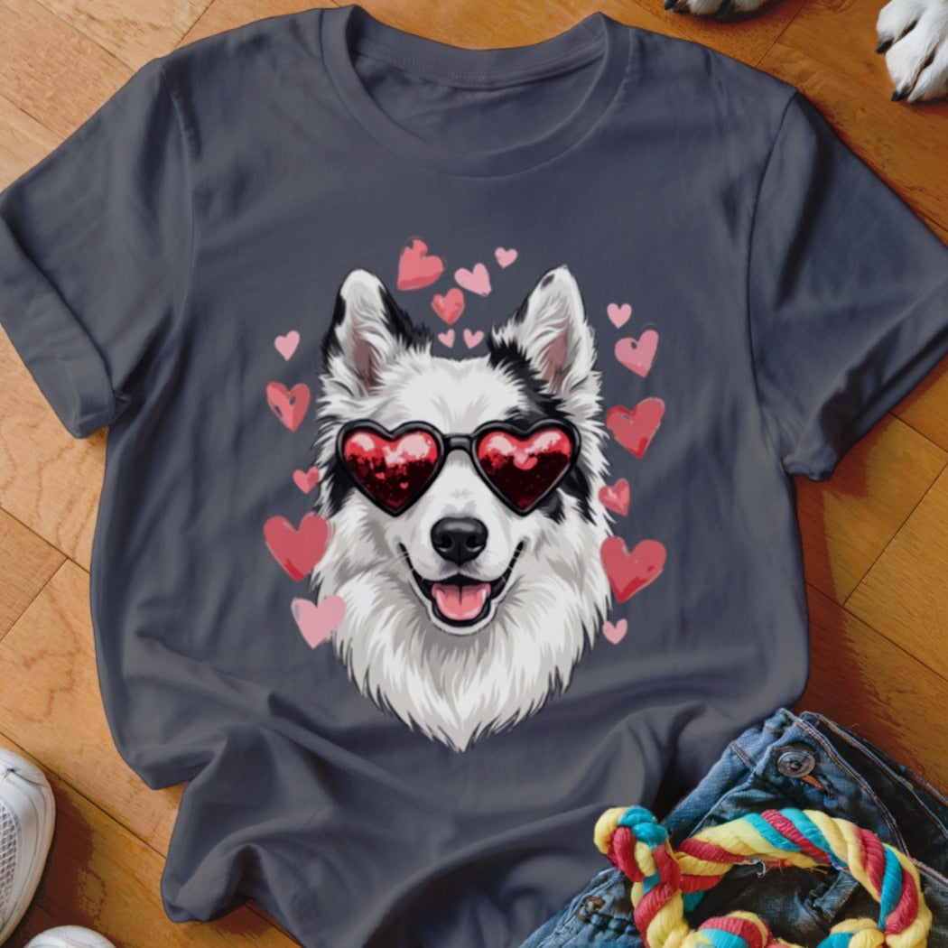 Dark grey t-shirt featuring a graphic of a white and black dog wearing heart-shaped sunglasses surrounded by pink hearts.