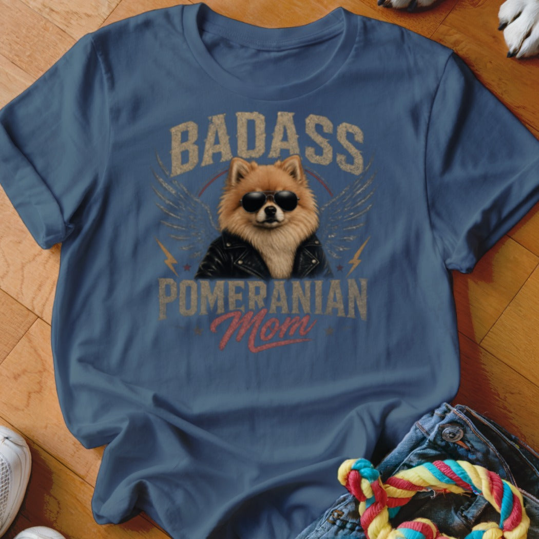 Pomeranian mom wearing sunglasses and a leather jacket with wings and text.