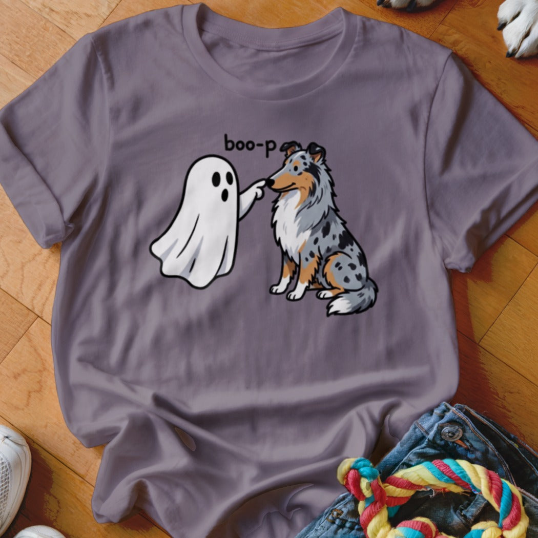 Ghost playfully boops a sitting Australian Shepherd dog on the nose.
