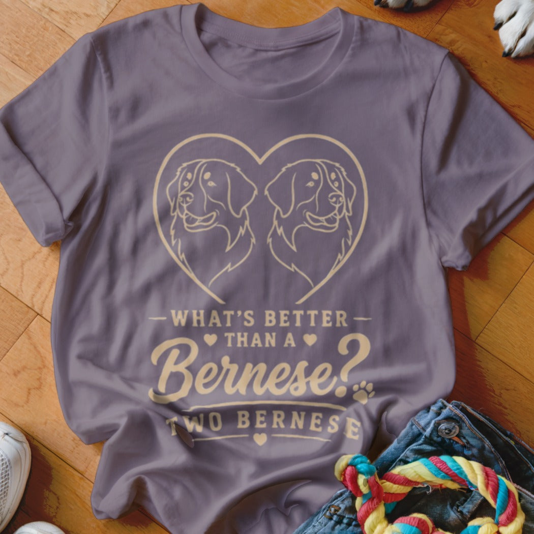 Purple t-shirt with heart outline containing two Bernese dog heads and text.