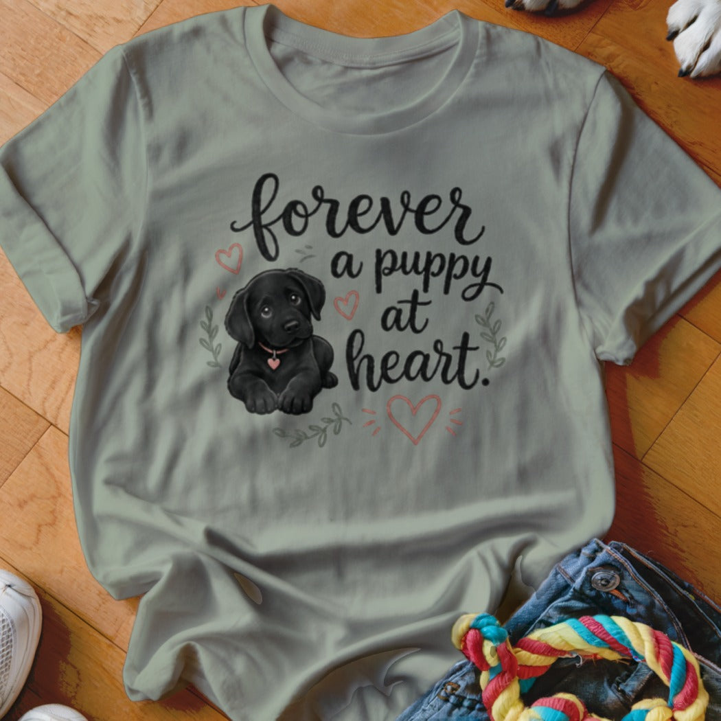 Light grey t-shirt with a black Labrador puppy and the text "forever a puppy at heart".