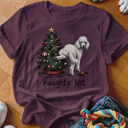 White poodle by a Christmas tree with "naughty list" text.