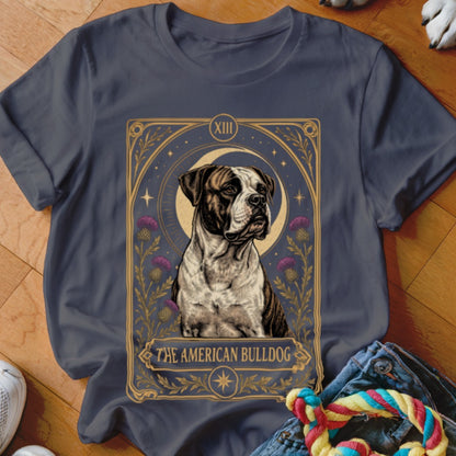Dark gray t-shirt featuring a tarot-style illustration of an American Bulldog surrounded by thistles and a crescent moon.