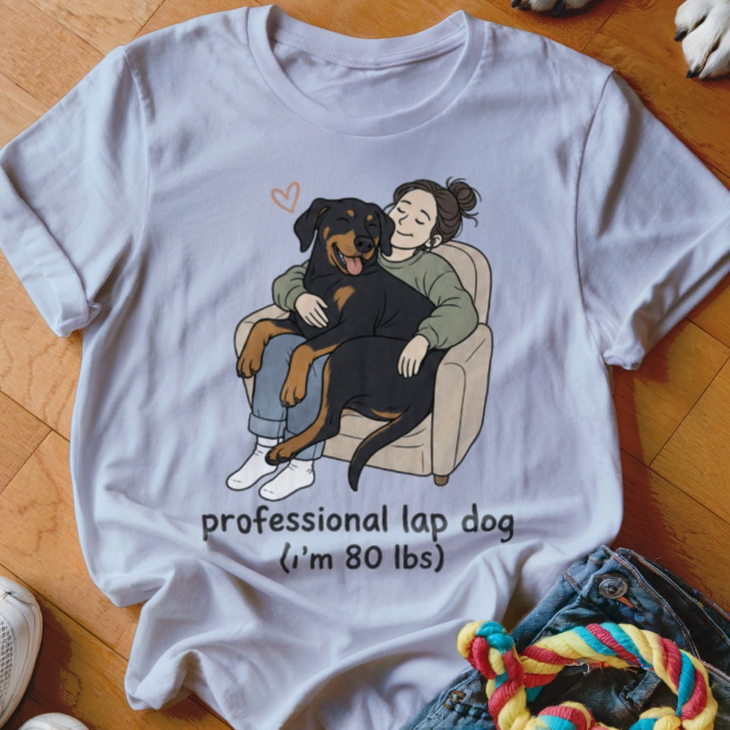 T-shirt with illustration of woman hugging Rottweiler with text "professional lap dog (I'm 80 lbs)".