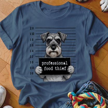 Schnauzer mugshot with "professional food thief" sign and height markers.