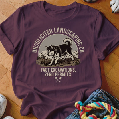 Maroon t-shirt with graphic of husky, "Unsolicited Landscaping Co.", and "Fast Excavations. Zero Permits."