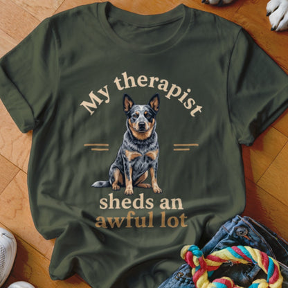 Green t-shirt with a seated dog graphic and text "My therapist sheds an awful lot."