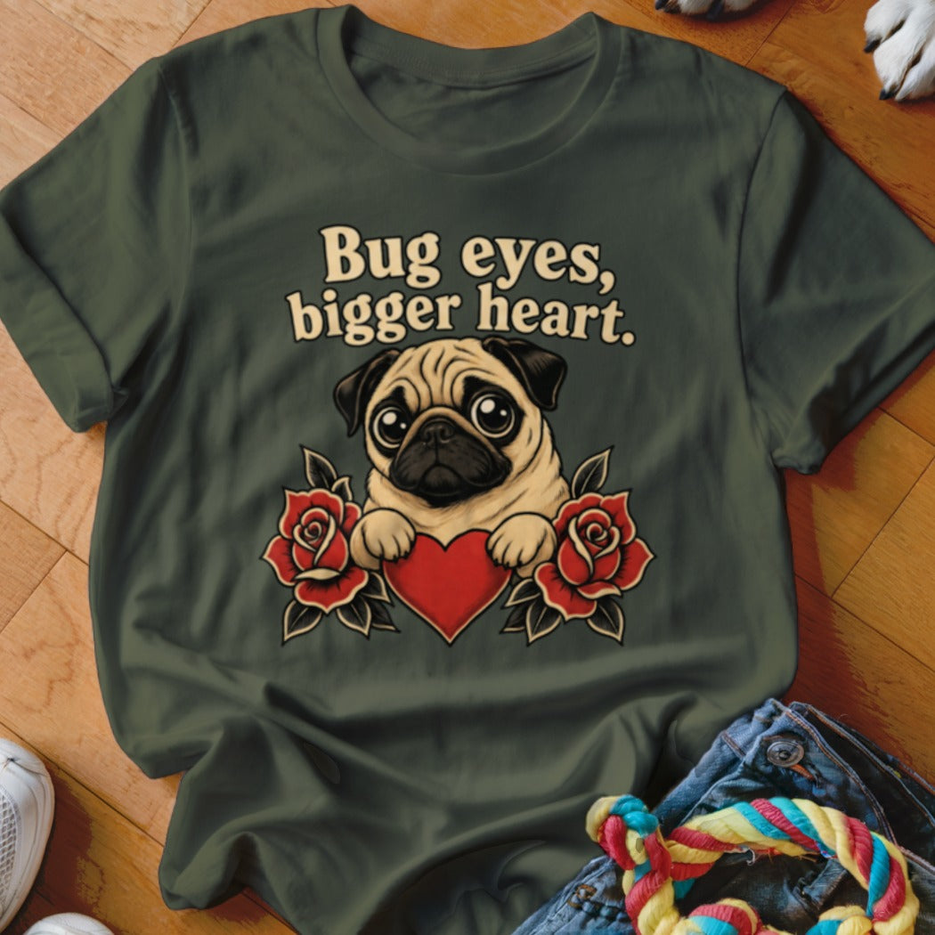 Green t-shirt with pug, red roses, red heart, and text "Bug eyes, bigger heart."