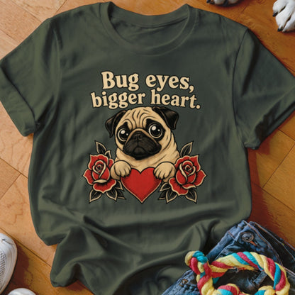 Green t-shirt with pug, red roses, red heart, and text "Bug eyes, bigger heart."