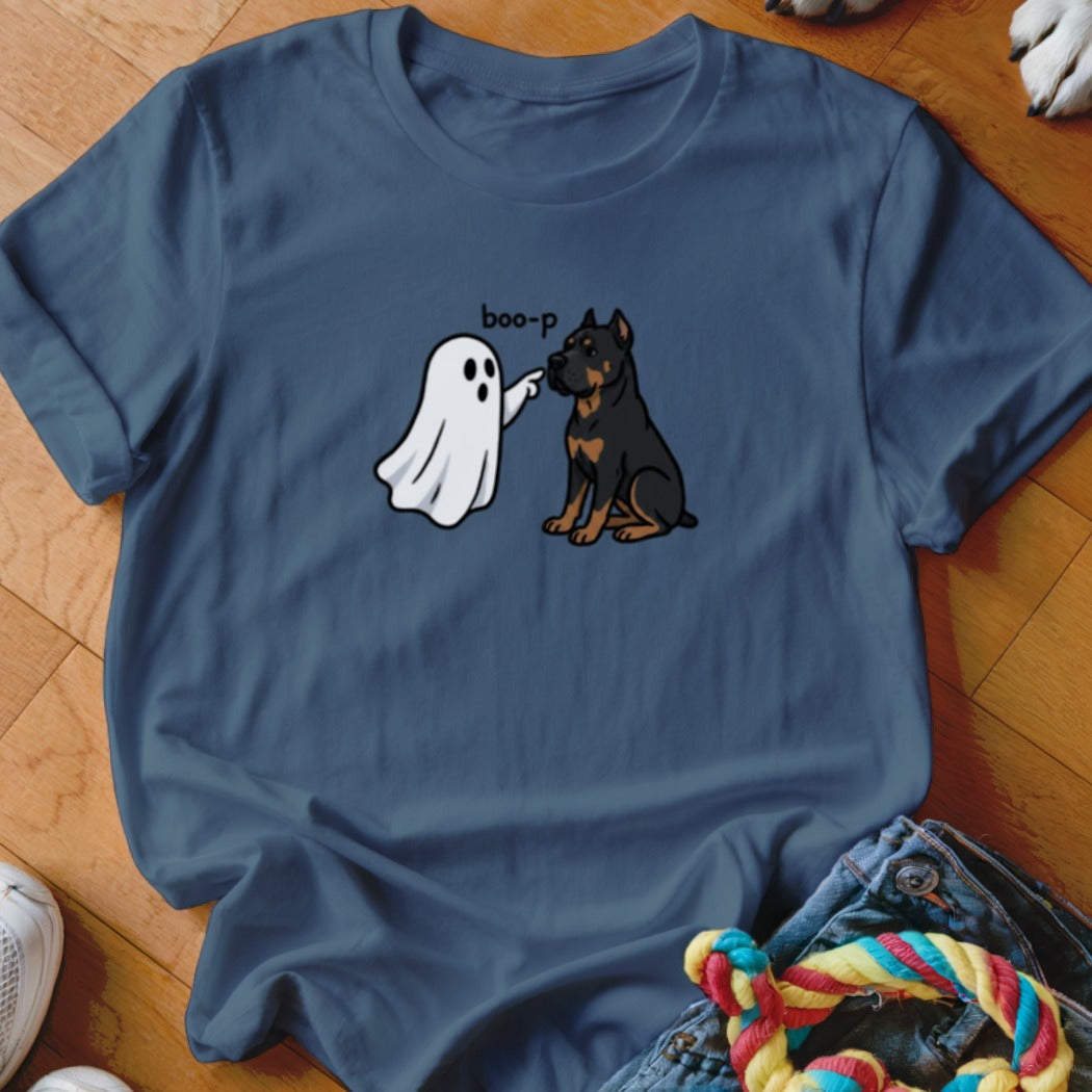 A ghost "boop-p" touches a seated Rottweiler dog on the nose.