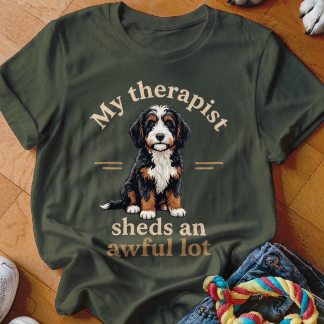 Bernese Mountain Dog on a green t-shirt that says "My therapist sheds an awful lot".
