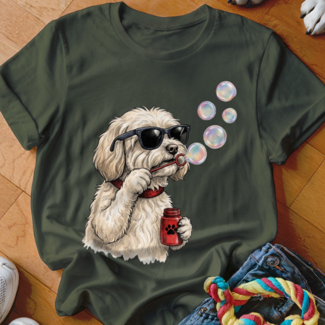 Dark green t-shirt featuring a graphic of a white dog wearing sunglasses and blowing bubbles.
