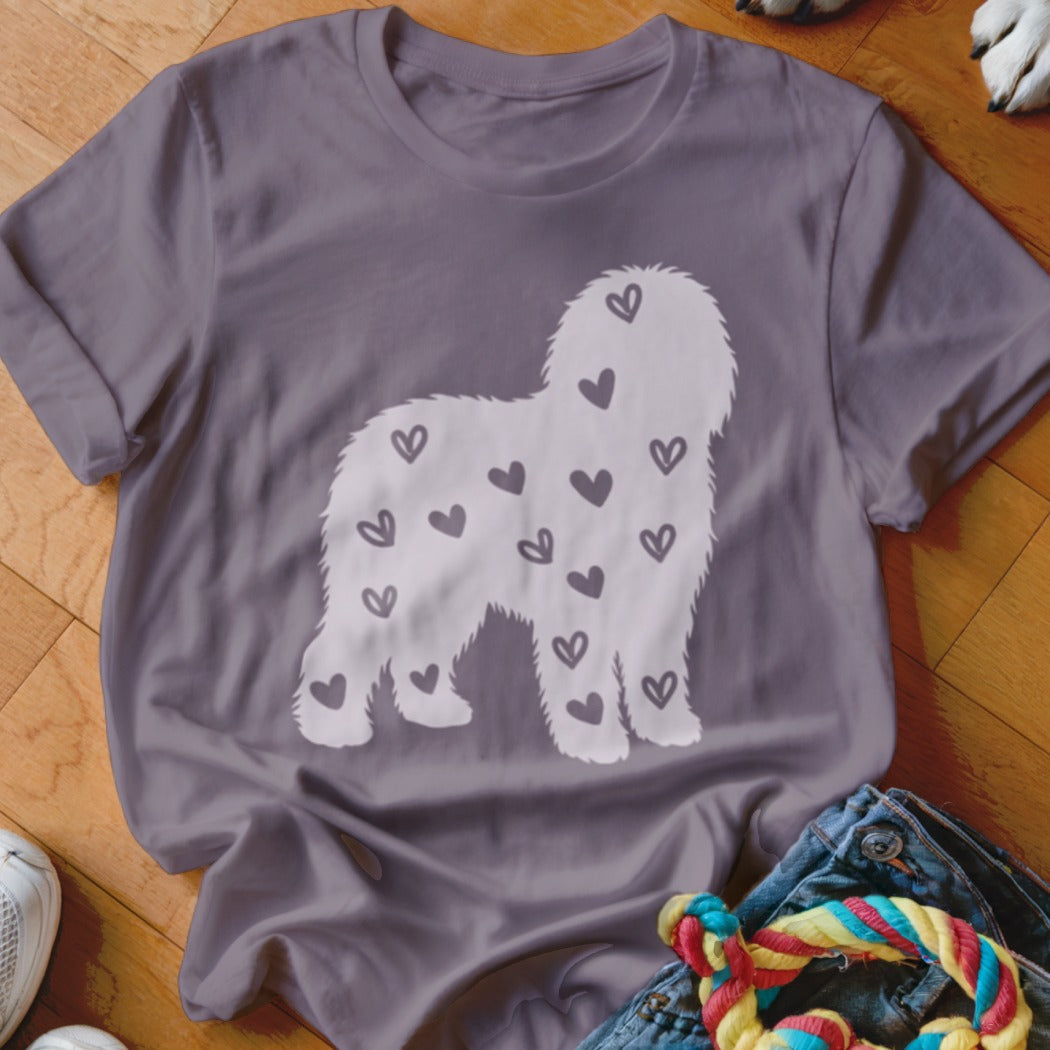 Purple t-shirt with white fluffy dog silhouette filled with small hearts.