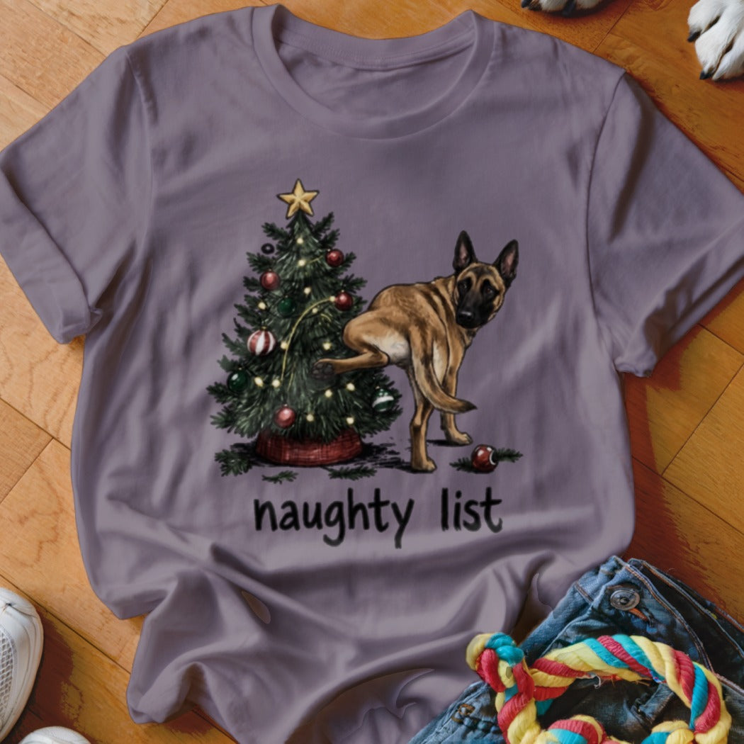 German Shepherd by Christmas tree with text "naughty list."
