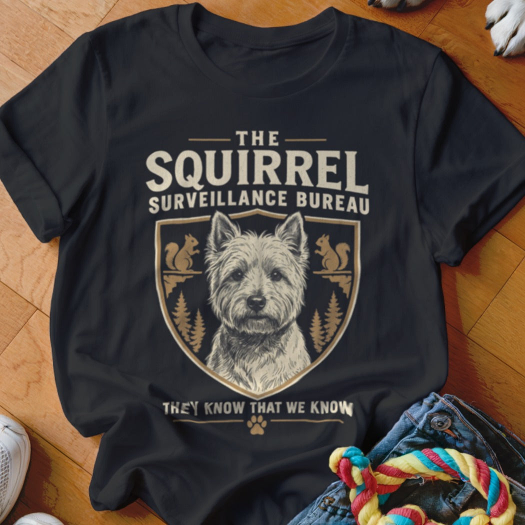 Black t-shirt featuring a West Highland White Terrier illustration inside a crest with squirrel graphics and text.