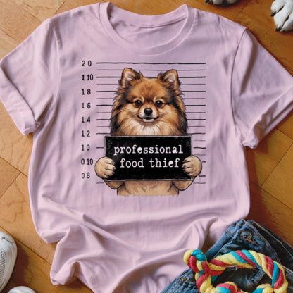 Pomeranian dog mugshot with text "professional food thief."