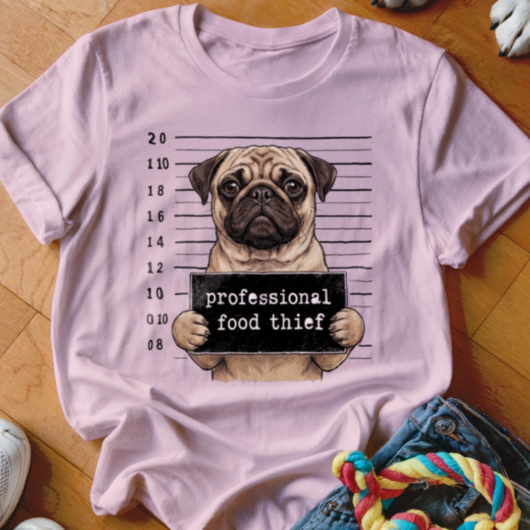 Pink t-shirt with a pug holding a "professional food thief" sign.