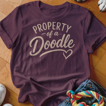 Maroon t-shirt with "Property of a Doodle" text and heart graphic.