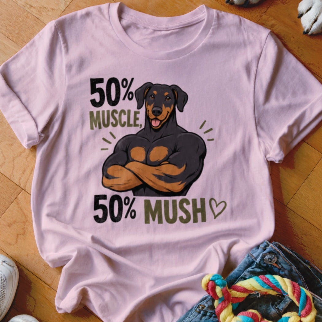 Pink t-shirt with a muscular Doberman graphic reading "50% MUSCLE, 50% MUSH".