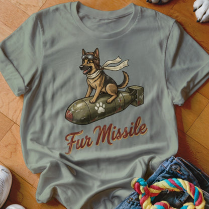 German Shepherd wearing aviator goggles rides a bomb labeled "Fur Missile."