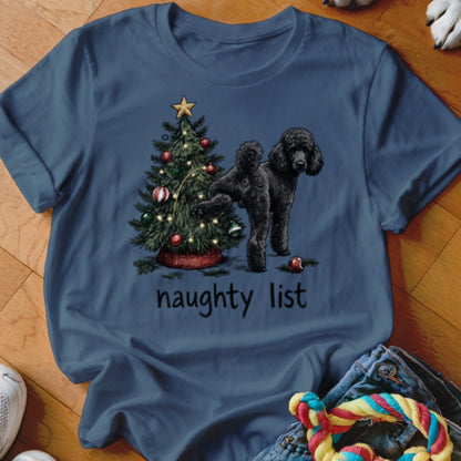 Black poodle next to a Christmas tree with the text "naughty list"