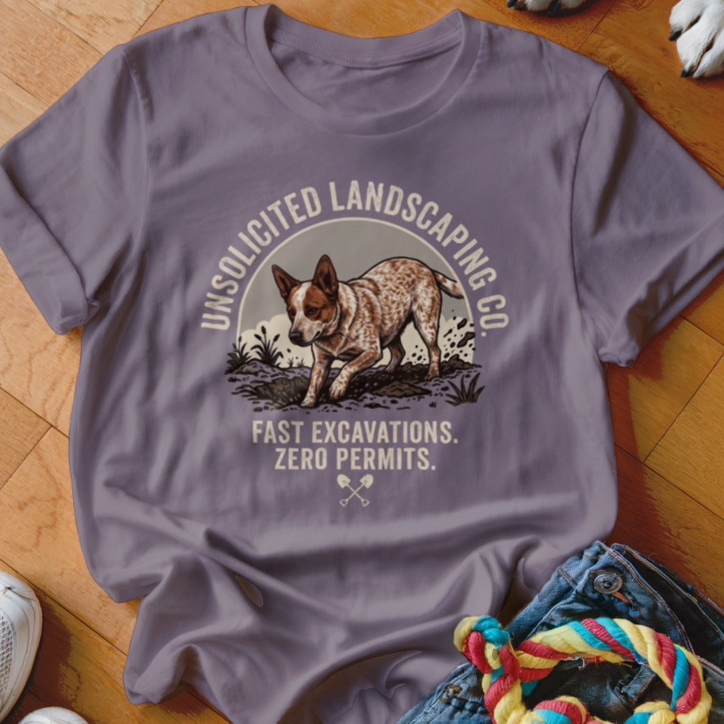 Purple t-shirt with a dog digging, "Unsolicited Landscaping Co." and "Fast Excavations. Zero Permits." text.