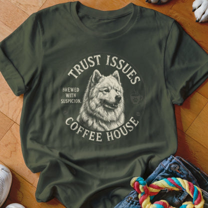 Green t-shirt featuring a wolf's head with text "TRUST ISSUES COFFEE HOUSE" and "BREWED WITH SUSPICION."