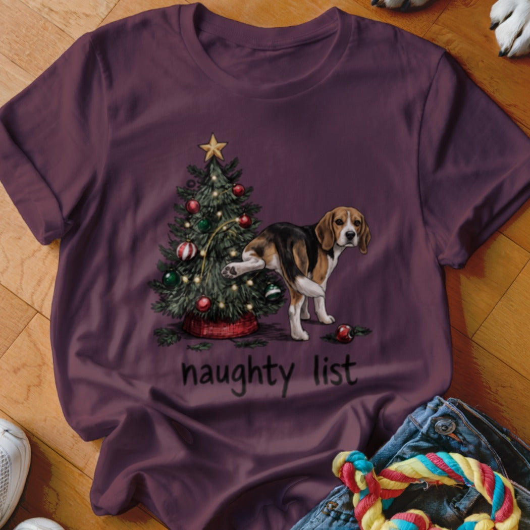 Beagle dog near Christmas tree with "naughty list" text.