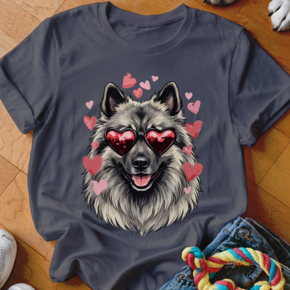 A dark gray t-shirt featuring an illustration of a fluffy dog wearing heart-shaped sunglasses, surrounded by pink hearts.