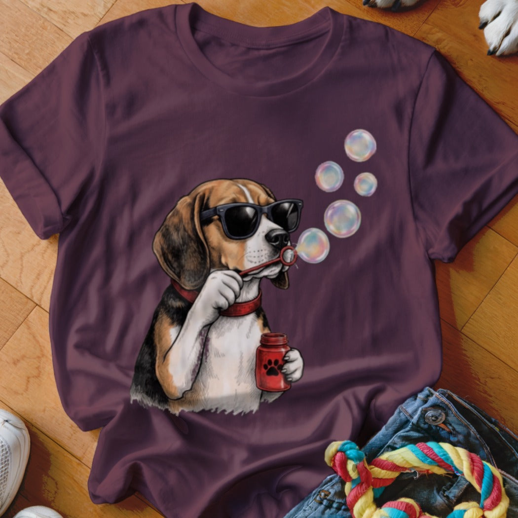 Dark purple crewneck t-shirt featuring a graphic of a beagle wearing sunglasses and blowing soap bubbles.