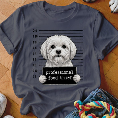 White Maltese dog with a "professional food thief" sign in a police lineup.