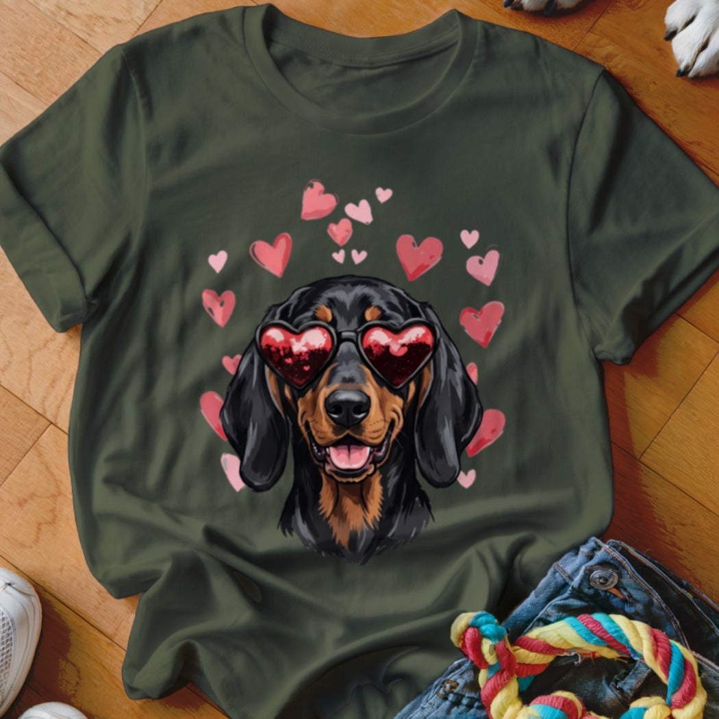 Dark green t-shirt featuring a dachshund wearing heart-shaped sunglasses surrounded by pink hearts.