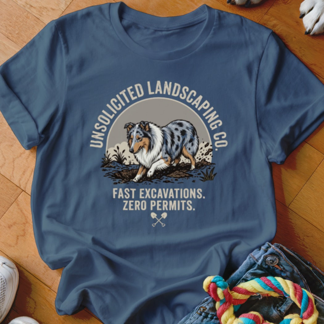 T-shirt with a blue merle dog digging, text "Unsolicited Landscaping Co." and "Fast Excavations. Zero Permits."