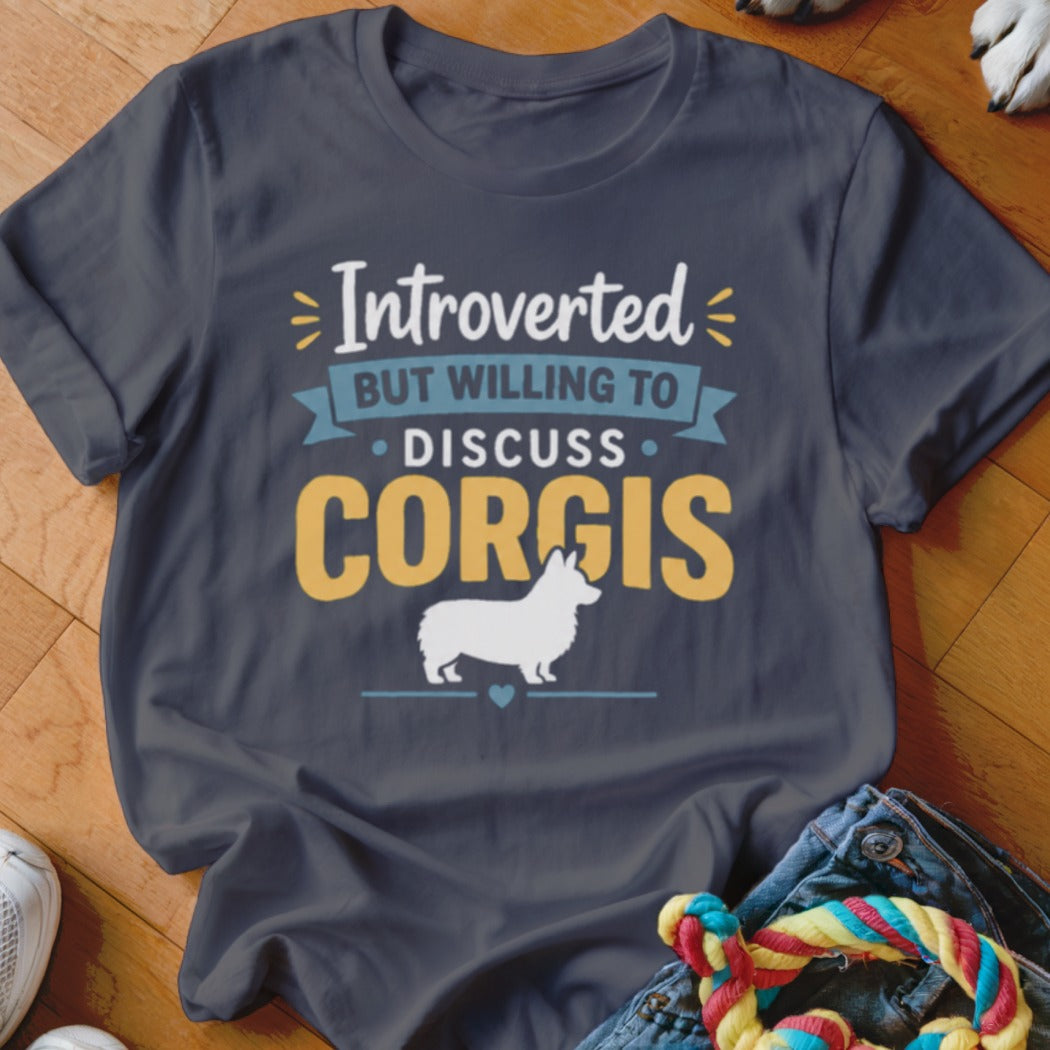 Dark t-shirt with white and yellow text: "Introverted But Willing To Discuss CORGIS" and a white corgi silhouette.