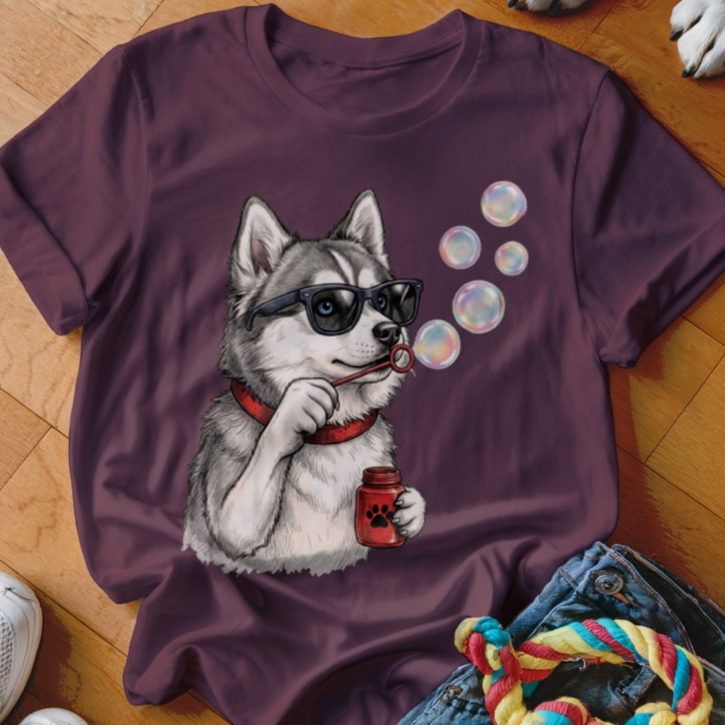 Maroon t-shirt featuring a graphic of a husky wearing sunglasses and blowing soap bubbles.