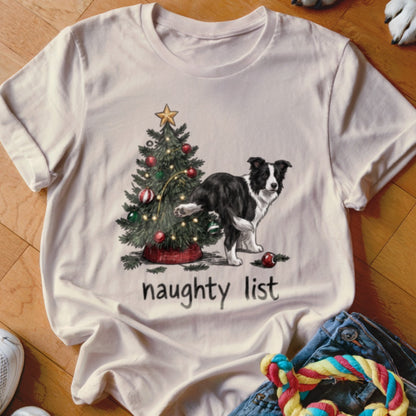 A light-colored t-shirt features a graphic of a Border Collie peeing on a Christmas tree, with the text "naughty list" underneath.