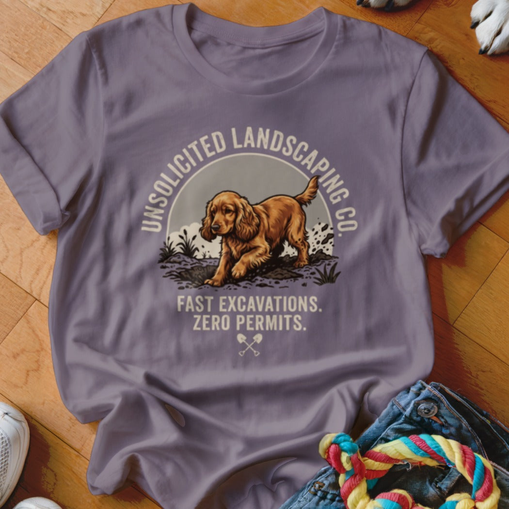 T-shirt graphic: dog digging with text "UNSOLICITED LANDSCAPING CO. FAST EXCAVATIONS. ZERO PERMITS."