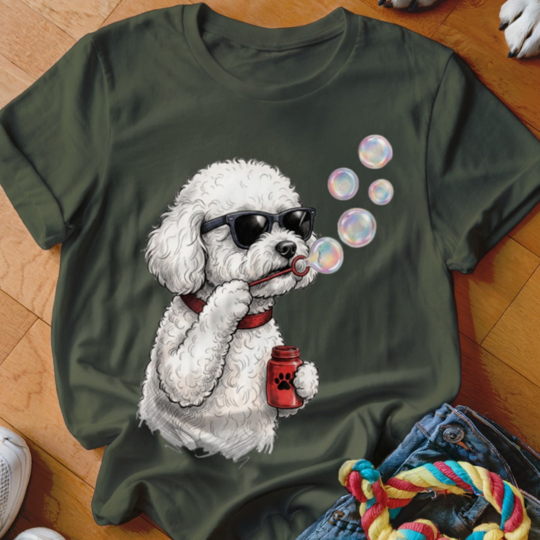 Dark green t-shirt featuring a graphic of a white poodle wearing sunglasses and blowing bubbles.