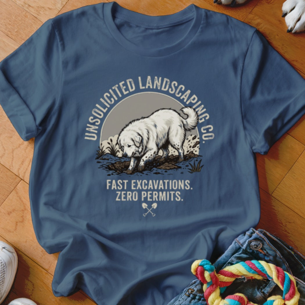 Blue t-shirt with graphic of dog digging and text "UNSOLICITED LANDSCAPING CO. FAST EXCAVATIONS. ZERO PERMITS."