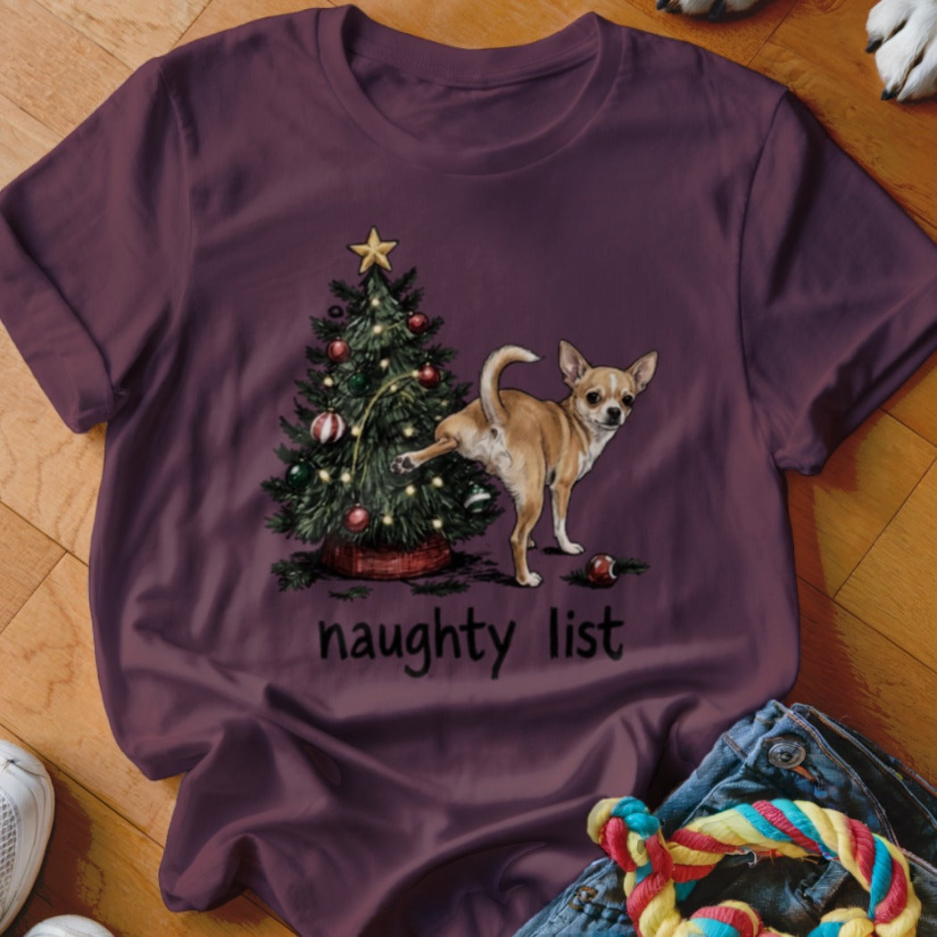Chihuahua peeing on Christmas tree with "naughty list" text.