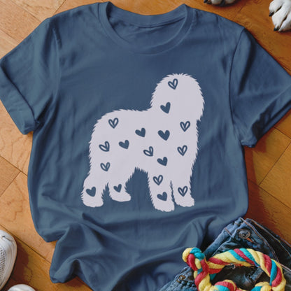 Blue t-shirt with silhouette of a shaggy dog covered in hearts.