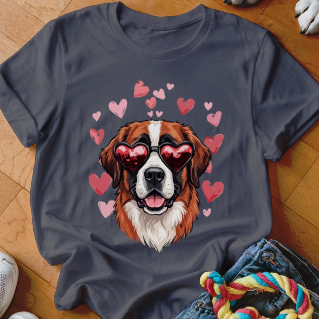 A dark gray t-shirt featuring a Saint Bernard dog wearing heart-shaped sunglasses surrounded by pink hearts.