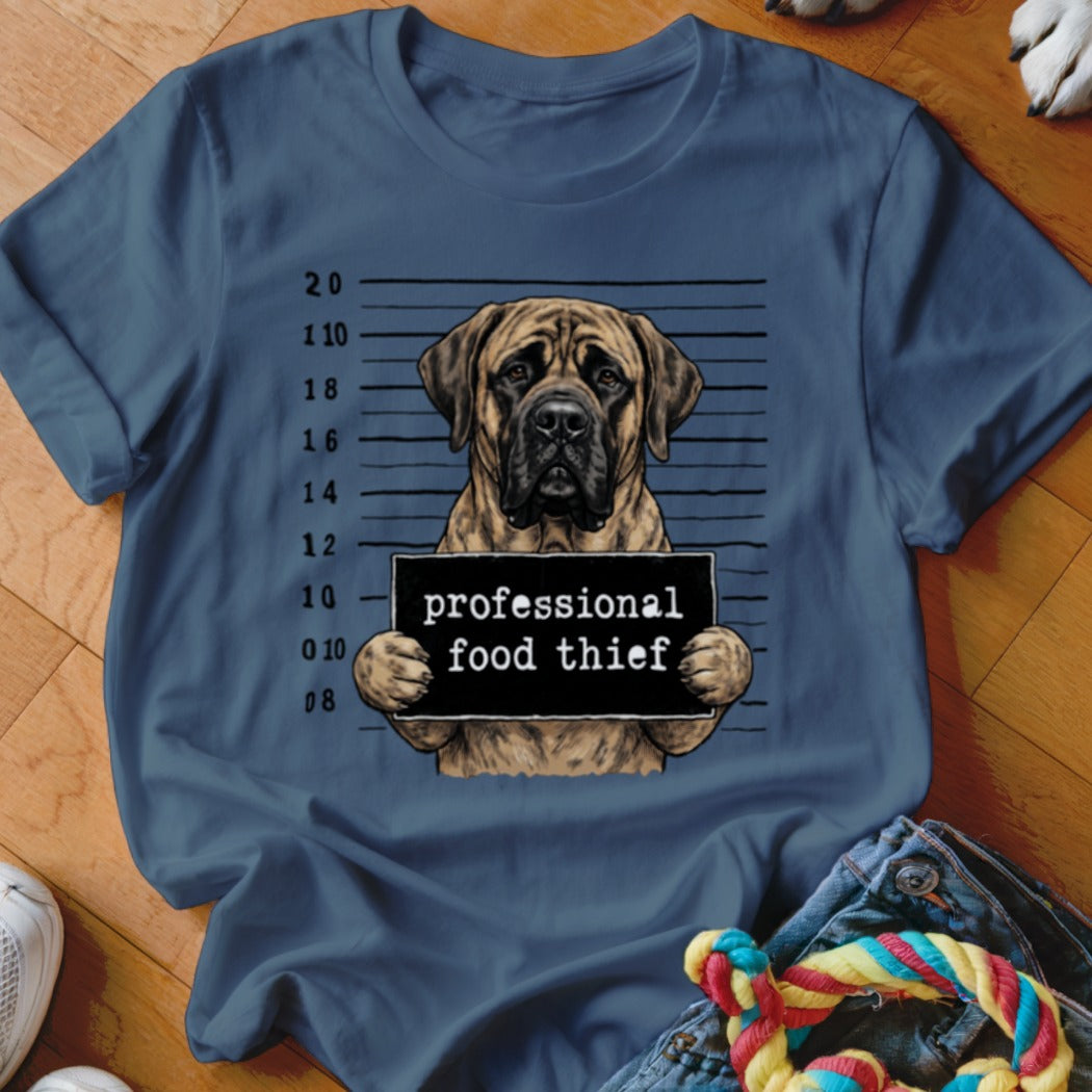 Mastiff in mugshot holding sign that says "professional food thief".