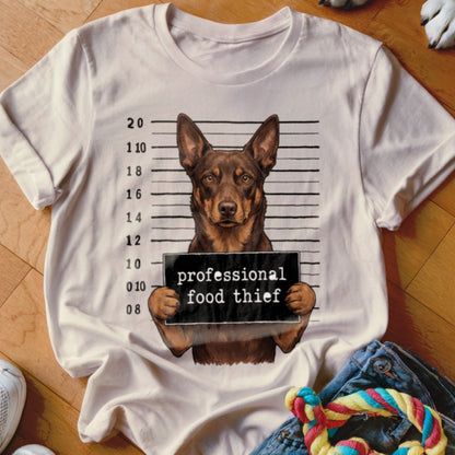 T-shirt with a dog in a mugshot holding a "professional food thief" sign.