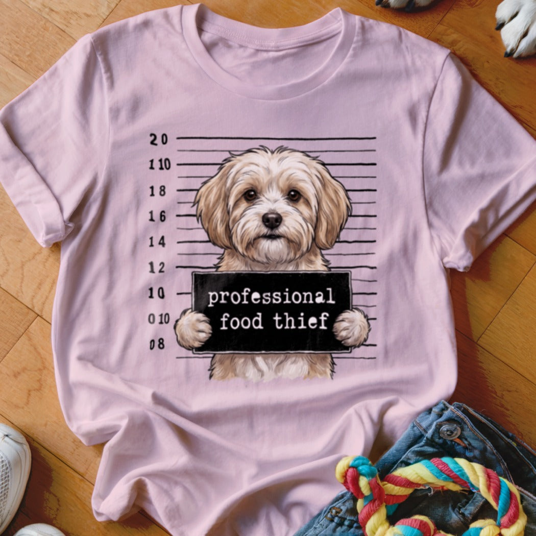 Pink t-shirt with a dog mugshot saying "professional food thief".