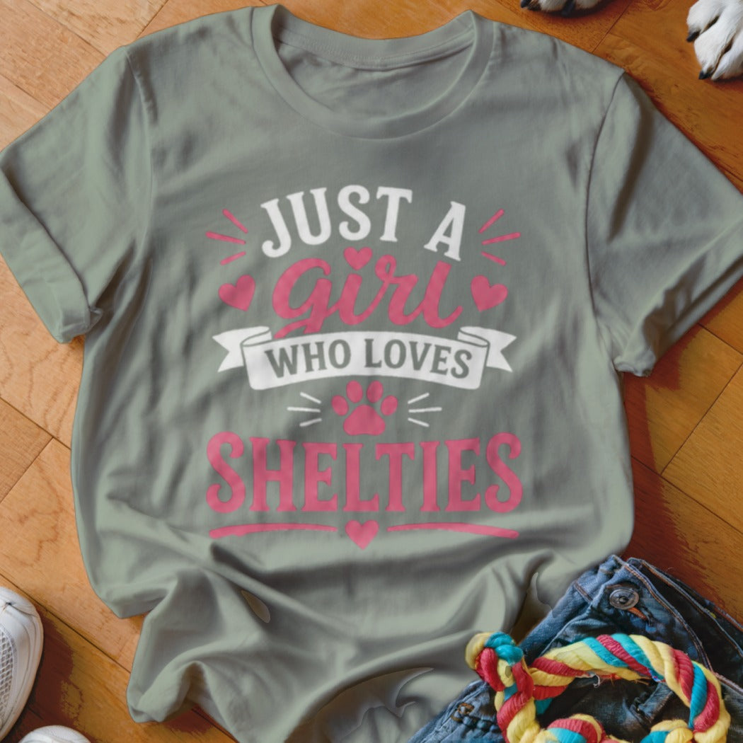 Grey t-shirt with pink text: "JUST A girl WHO LOVES SHELTIES".