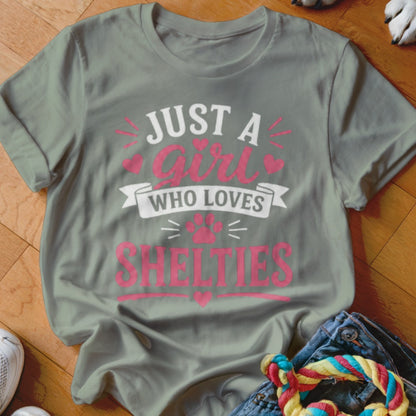 Grey t-shirt with pink text: "JUST A girl WHO LOVES SHELTIES".
