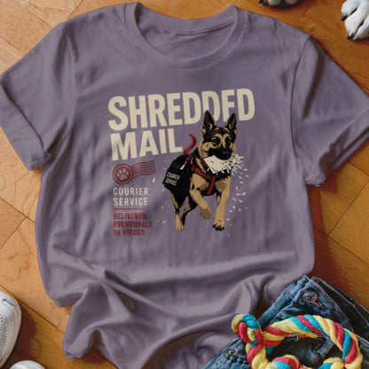 German Shepherd wearing a courier bag, "SHREDDED MAIL" text.